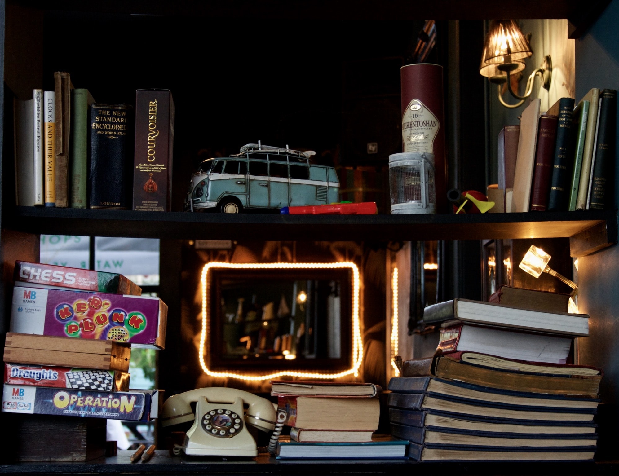 Have you heard of the book nook trend? A book nook is a cute little insert that tucks between the books on your bookshelf. It's basically a whole new (miniature!) world on your bookshelf. Pretty cool, right? Look here for the best book nook ideas! 